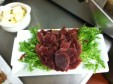 Smoking Goose Duck prosciutto with frisee and truffle butter