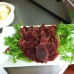 smoking goose duck prosciutto with frisée and truffle butter