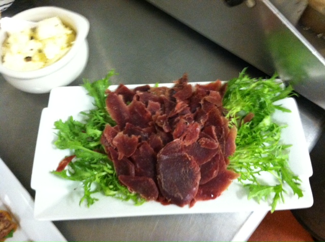 Smoking Goose Duck prosciutto with frisee and truffle butter